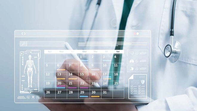 Doctor writing on a calendar